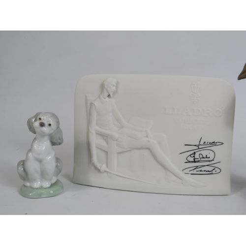 72 - Lladro figurine of a girl bathing a dog, a small dog figurine and a point of sale.