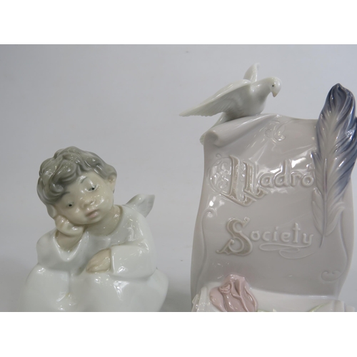 75 - Lladro Angel and a point of sale scroll.