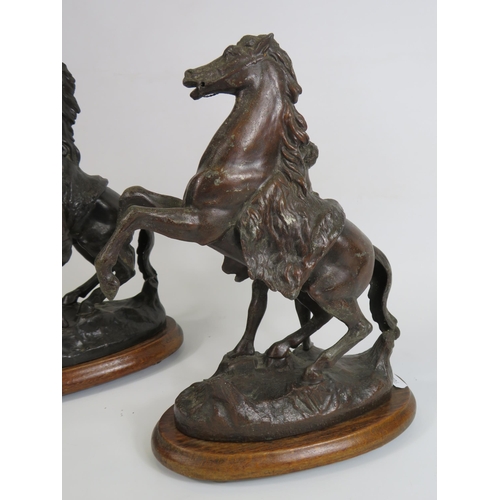 83 - Pair of vintage spelter Marley horses sculptures which stand approx 31cm tall.