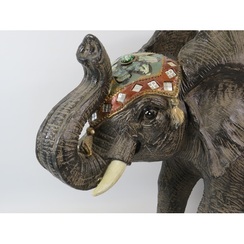 88 - Large resin elephant sculpture decorated with mirrors, jewels and mother of pearl, it stands approx ... 