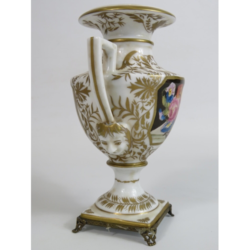 99 - Meissen style twin handle vase sitting on brass feet, 16cm tall.