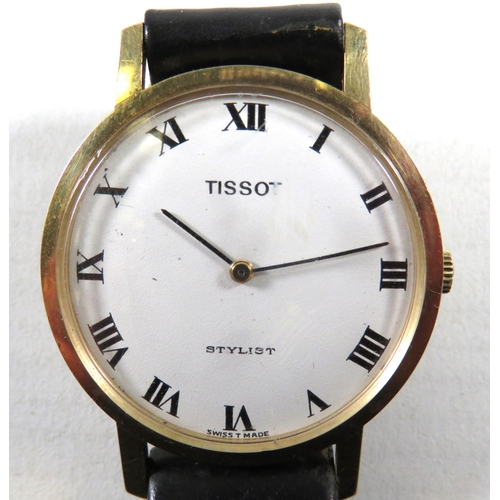 414 - Tissot Stylist Gents watch with 9ct Gold case. Leather strap, Running order.  Comes complete with or... 