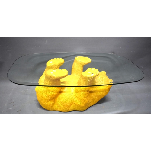1008 - Novelty Coffee table with upside down bear as support. . Glass top.  See photos.