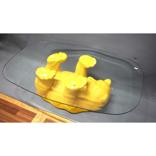 1008 - Novelty Coffee table with upside down bear as support. . Glass top.  See photos.