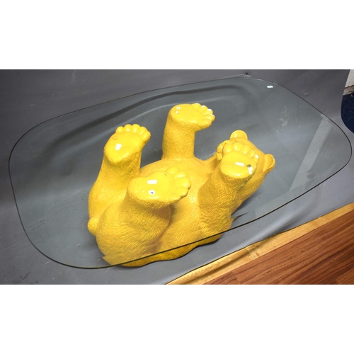 1008 - Novelty Coffee table with upside down bear as support. . Glass top.  See photos.