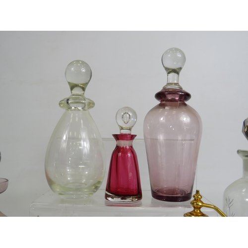 143 - Selection of various glass perfume / scent bottles including Caithness etc.