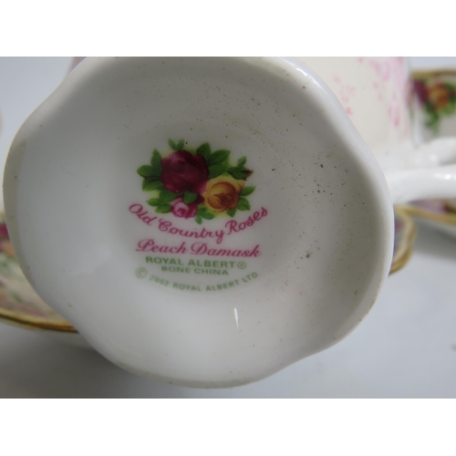 166 - 2 Royal Albert old country roses tennis sets and a Peach damask cup and saucer.