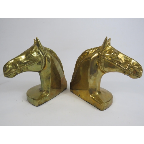 168 - 2 Brass horse head book ends, 16cm tall and 13cm by 9cm.