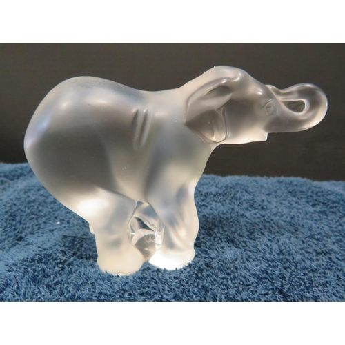 193 - Signed Lalique glass elephant 8cm tall and 12cm long.