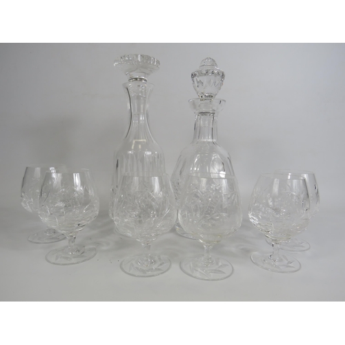 199 - Two good quality crystal glass decanters and six Stuart crystal wine glasses.