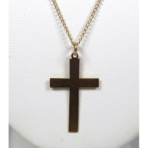 427 - 9ct Yellow Gold Crucifix hung on a 14 inch, 9ct Gold Chain.   Total weight 1.8g  see photos.