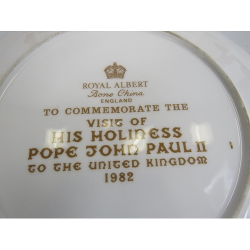 605 - A Plate and Six cups to commemorate The Pope John Paul II visit to uk in 1982 by Royal Albert.