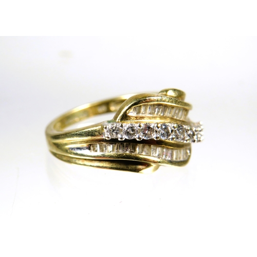 446 - 9ct Yellow Gold Diamond set Wave ring.  Finger size 'L'   3.0g with approx 0.30 pts of Diamonds.