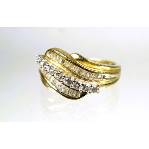 446 - 9ct Yellow Gold Diamond set Wave ring.  Finger size 'L'   3.0g with approx 0.30 pts of Diamonds.