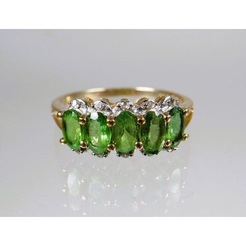 449 - 9ct Yellow Gold Ring set with a cluster of Green and Clear CZ gemstones.. Finger size 'M-5'   1.8g