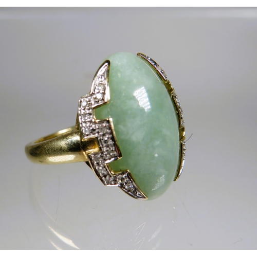 450 - 9ct Yellow Gold Ring set with a large Oval shaped Jade which measures 20 x 15 mm surrounded by Melee... 