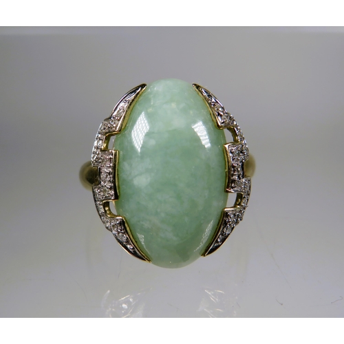 450 - 9ct Yellow Gold Ring set with a large Oval shaped Jade which measures 20 x 15 mm surrounded by Melee... 