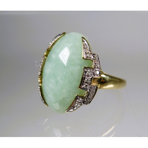 450 - 9ct Yellow Gold Ring set with a large Oval shaped Jade which measures 20 x 15 mm surrounded by Melee... 