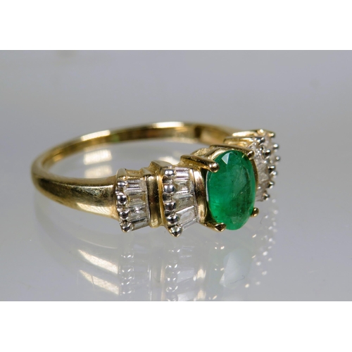 453 - 9ct Yellow Gold Ring set with a Central Oval Emerald surrounded by multiple Diamonds.  Finger size '... 