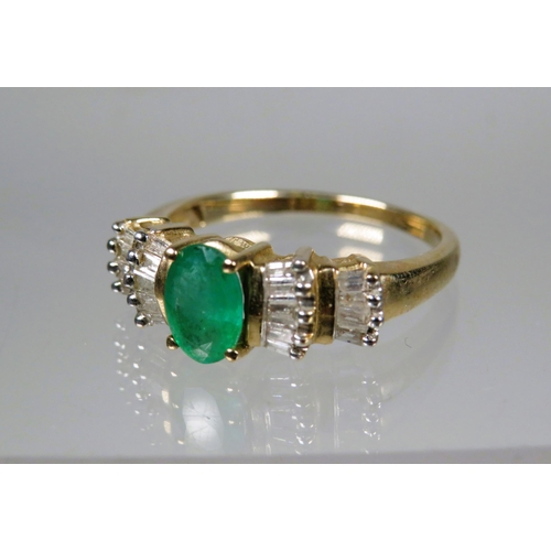 453 - 9ct Yellow Gold Ring set with a Central Oval Emerald surrounded by multiple Diamonds.  Finger size '... 