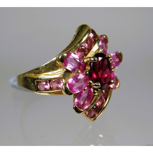 455 - 9ct Yellow Gold Ring set with Pink Tourmaline in a flower pattern.   Finger size 'M'    4.5g