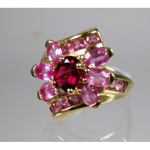 455 - 9ct Yellow Gold Ring set with Pink Tourmaline in a flower pattern.   Finger size 'M'    4.5g