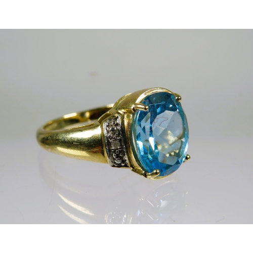 460 - 9ct Yellow Gold Ring set with a lovely large Topaz which measures 12 x 8 mm with melee Diamonds to t... 