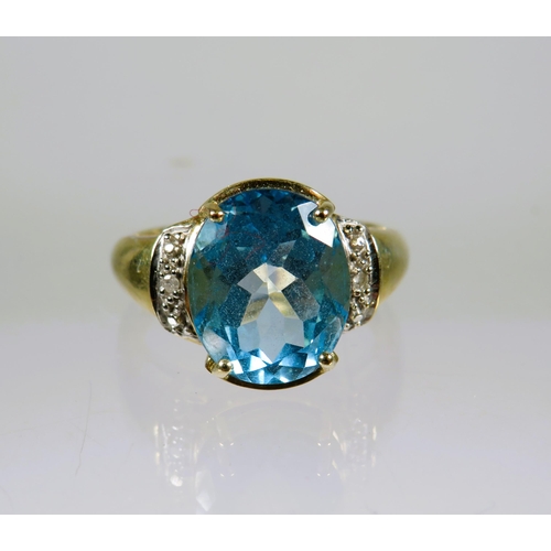 460 - 9ct Yellow Gold Ring set with a lovely large Topaz which measures 12 x 8 mm with melee Diamonds to t... 