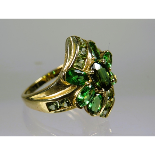 461 - 9ct Yellow Gold Ring set with Emerald coloured CZ in a Flower pattern.  Finger size 'P-5 to Q'   4.4... 