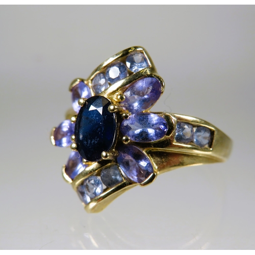 469 - 9ct Yellow Gold Ring set with Purple Gemstones in a flower pattern.  Finger size 'O-5 to P'     4.5g