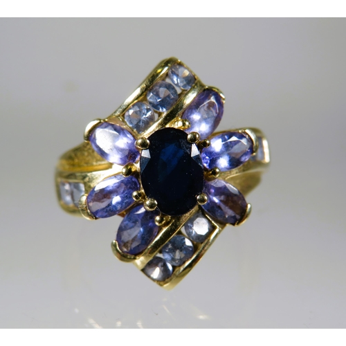 469 - 9ct Yellow Gold Ring set with Purple Gemstones in a flower pattern.  Finger size 'O-5 to P'     4.5g