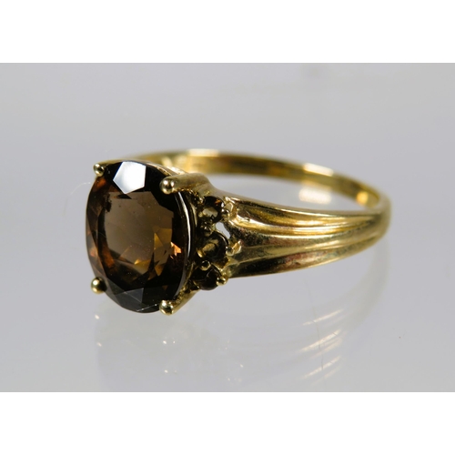 486 - 9ct Yellow Gold Ring set with a Smokey quartz (10 x 8mm ) with Melee Diamonds to shoulders. Finger s... 