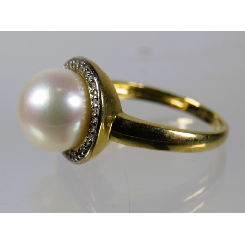 493 - 9ct Yellow Gold Ring set with a 10mm Pearl with Diamond Surround.  Finger size 'N-5'    3.5g