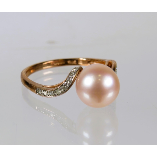 497 - 9ct Yellow Gold Ring set with an 8mm Pearl, Diamonds to shoulders.    Finger size 'O'   2.2g