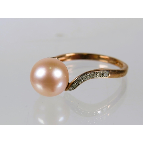 497 - 9ct Yellow Gold Ring set with an 8mm Pearl, Diamonds to shoulders.    Finger size 'O'   2.2g