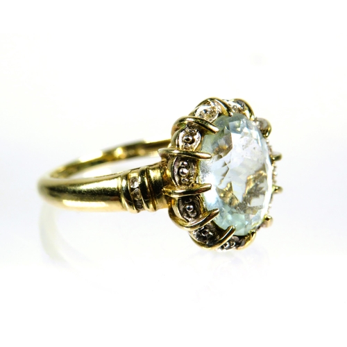 444 - 9ct Yellow Gold Ring set with a large Oval pale or White Topaz which measures approx 12 x 10mm. Fing... 