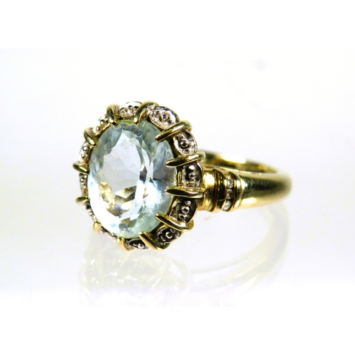 444 - 9ct Yellow Gold Ring set with a large Oval pale or White Topaz which measures approx 12 x 10mm. Fing... 