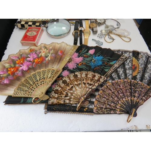 981 - Mixed Lot to include Jewellery box and costume contents, Dominoes,  Watches plus fans. See photos.