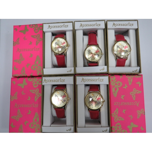 983 - Five ladies or Girls quartz watches with butterfly motif to the dial. Leather straps. All boxed and ... 