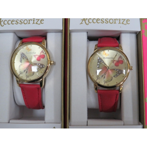 983 - Five ladies or Girls quartz watches with butterfly motif to the dial. Leather straps. All boxed and ... 