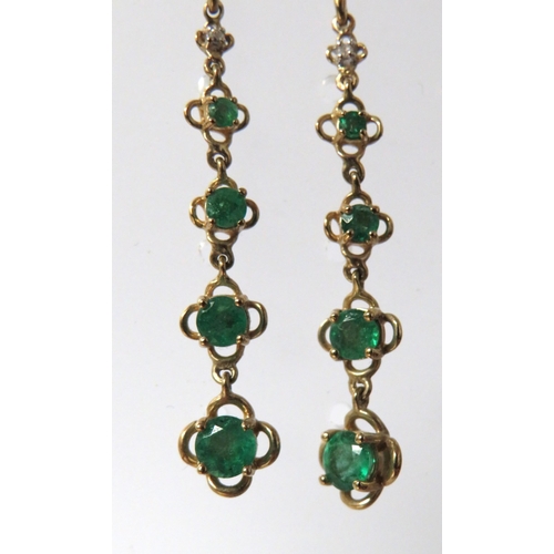 225A - Pair of 9ct Yellow Gold drop earrings set with Graduated Emeralds.  55mm long.  See photos.