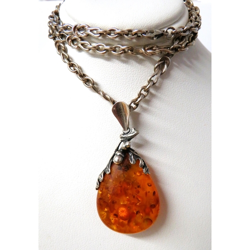 228A - 925 Silver set faux Amber pendant set on a long 24 inch silver gypsy link chain together with a Pand... 