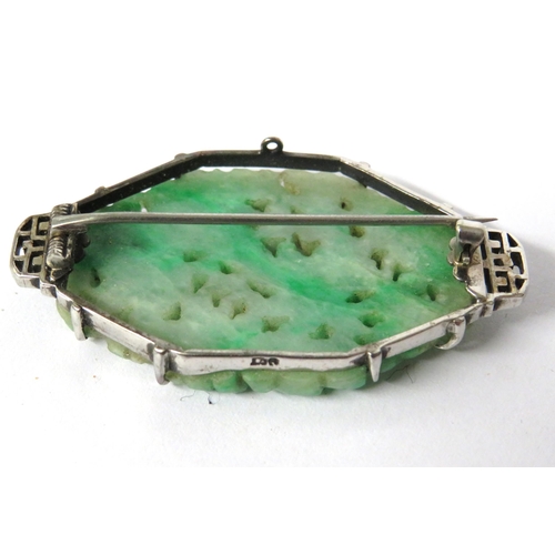 232A - Very Pretty carved Jade or Jadeite Brooch set in a 9ct White Gold Mount which measures approx 45 x 2... 