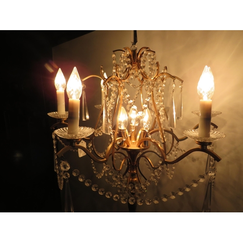 1747 - Brushed metal brass effect Standard lamp with 9 Candle bulbs and hanging glass lustres. Approx 67 in... 