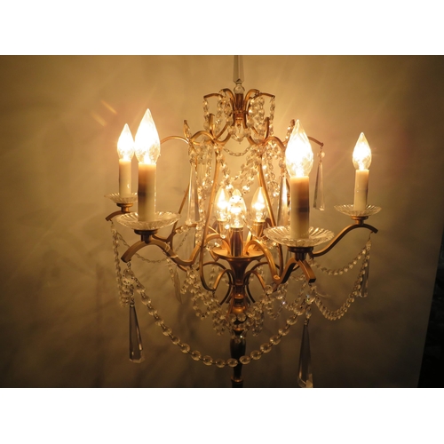 1747 - Brushed metal brass effect Standard lamp with 9 Candle bulbs and hanging glass lustres. Approx 67 in... 