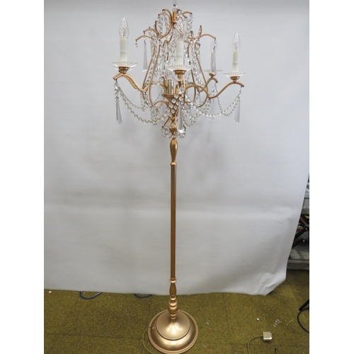 1747 - Brushed metal brass effect Standard lamp with 9 Candle bulbs and hanging glass lustres. Approx 67 in... 