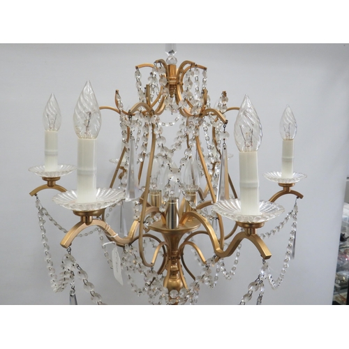 1747 - Brushed metal brass effect Standard lamp with 9 Candle bulbs and hanging glass lustres. Approx 67 in... 