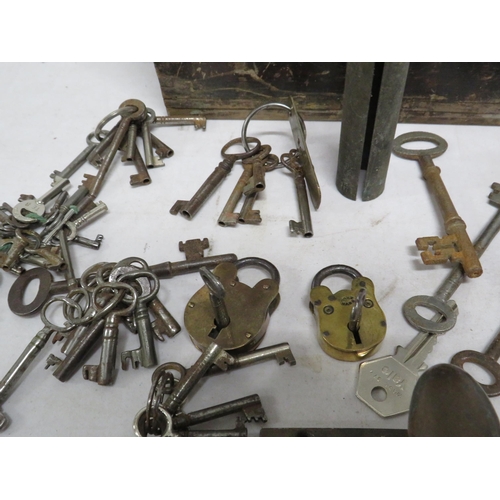 10 - Vintage wooden box containing a large selection of keys and 2 vintage brass padlocks etc.