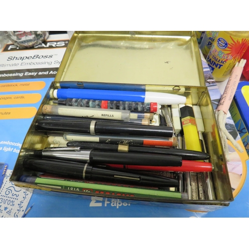 62 - Selection of art and craft supplies and various fountain pens in a vintage tin.