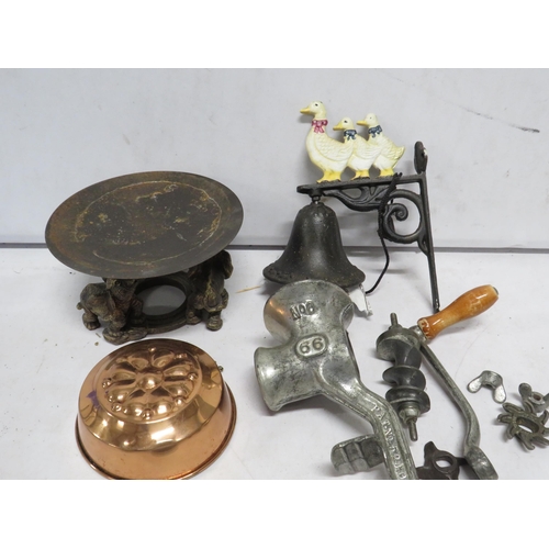 113 - Mixed lot to include a cast iron wall mounted bell, Vintage mincer, copper jelly mould etc.